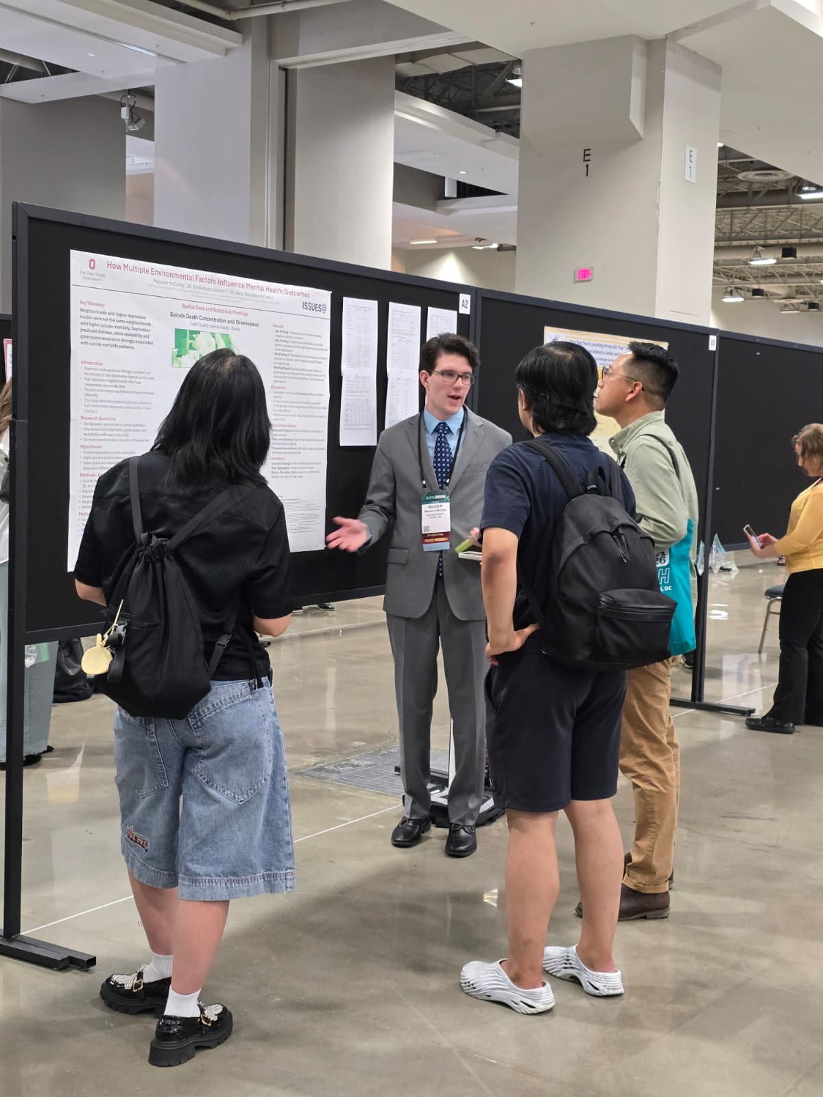 Malcolm presenting his poster